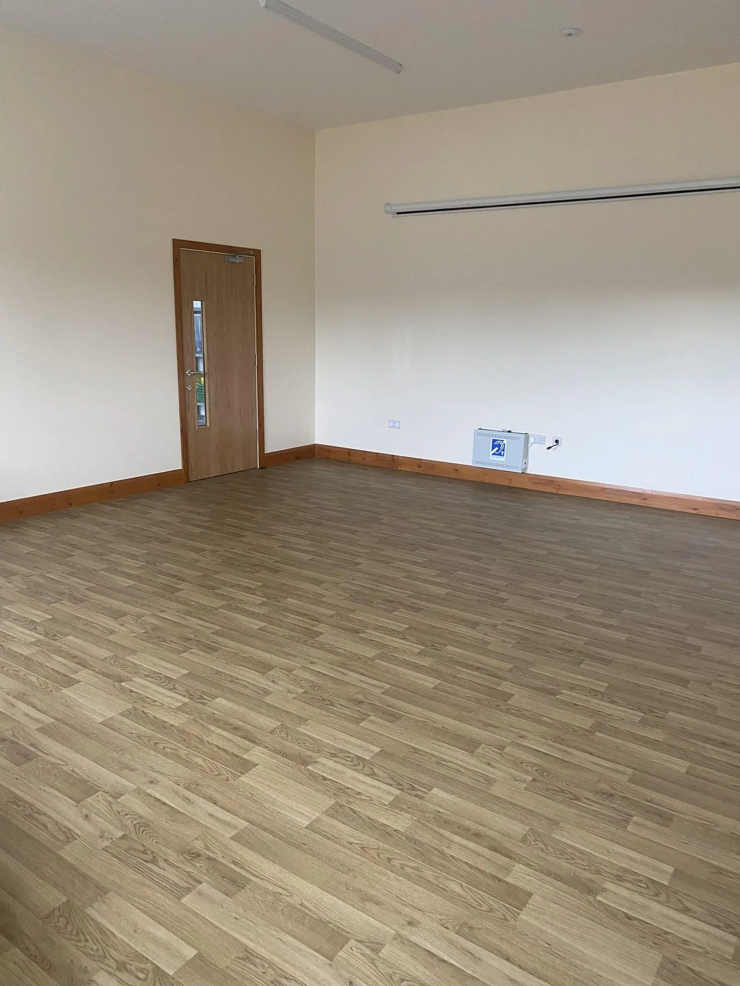 A bright, empty meeting room at the village hall